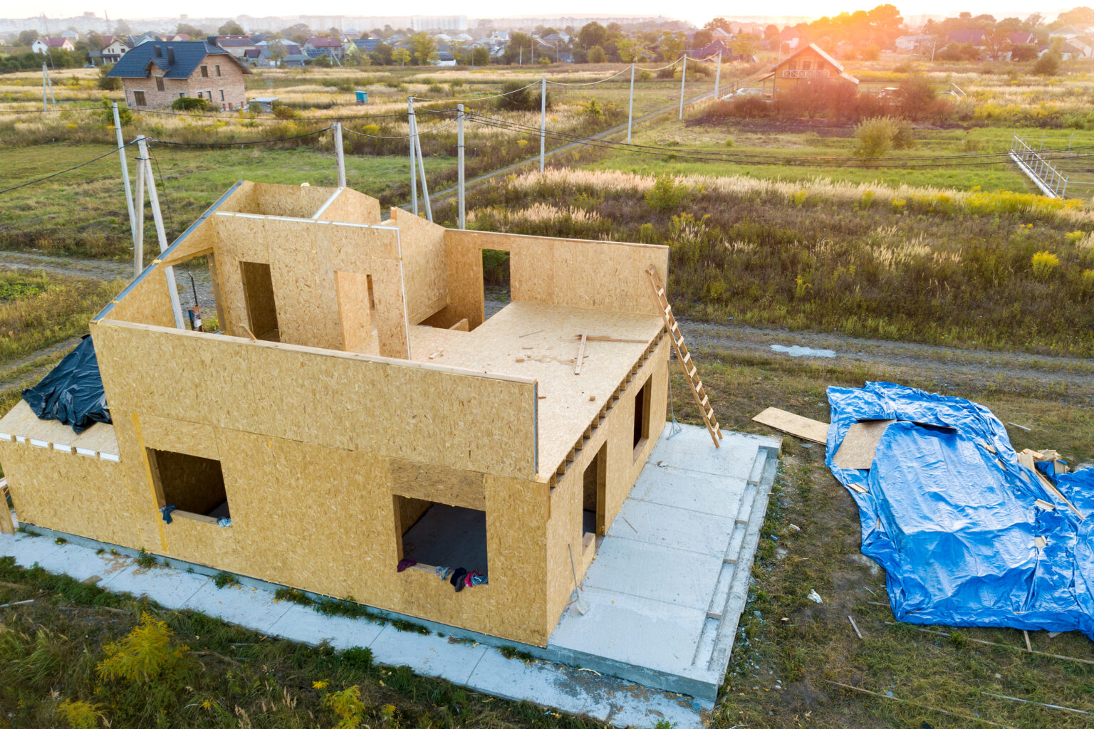 Construction of new and modern modular house. Walls made from composite wooden sip panels with styrofoam insulation inside. Building new frame of energy efficient home concept.